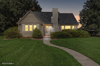 view of front of home with a yard