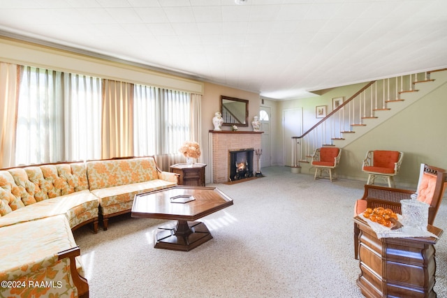 carpeted living room with a fireplace