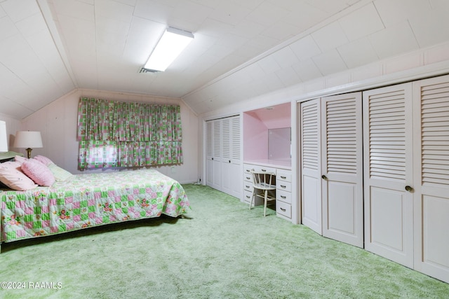 bedroom with light carpet and vaulted ceiling