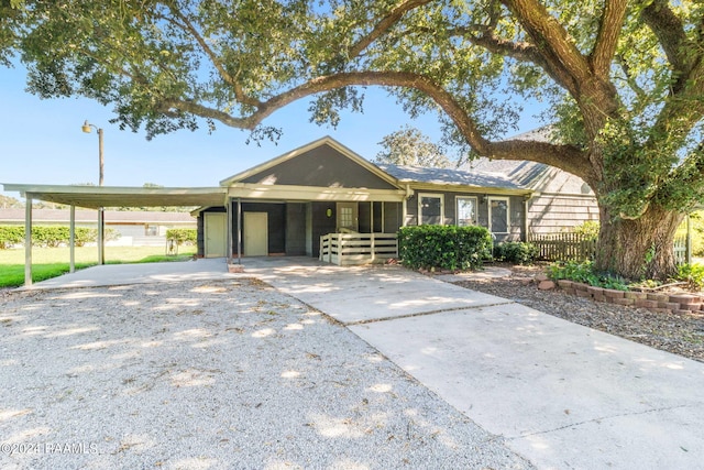 ranch-style house featuring a carport