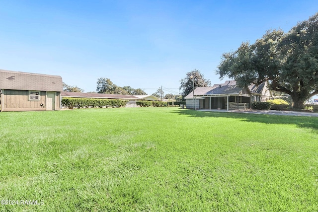 view of yard with a sunroom