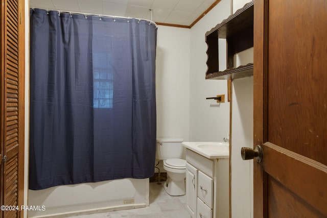 bathroom featuring walk in shower, crown molding, vanity, and toilet