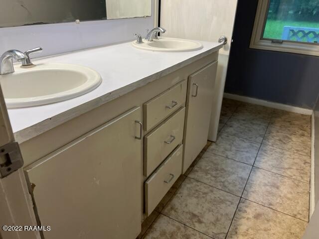 bathroom featuring tile patterned floors and vanity