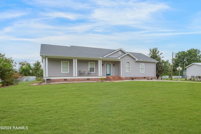 ranch-style home featuring a front yard and a porch