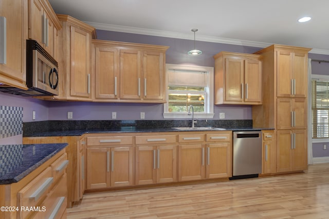 kitchen with hanging light fixtures, ornamental molding, sink, light hardwood / wood-style flooring, and stainless steel appliances