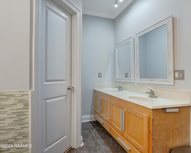 bathroom with ornamental molding, tile patterned floors, and vanity