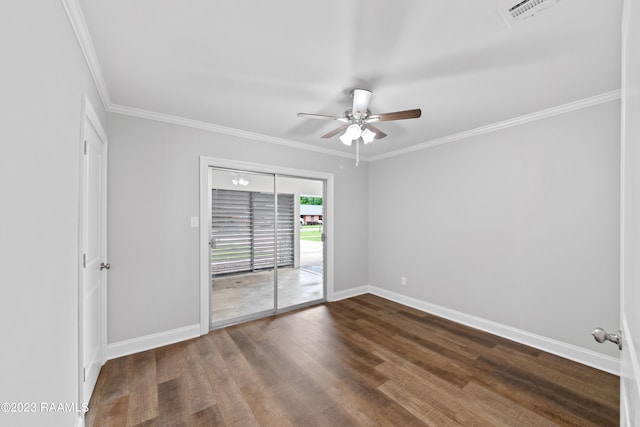 empty room featuring ceiling fan, hardwood / wood-style flooring, and crown molding