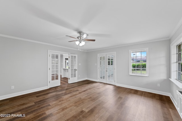 unfurnished living room with ceiling fan, dark hardwood / wood-style floors, french doors, and crown molding