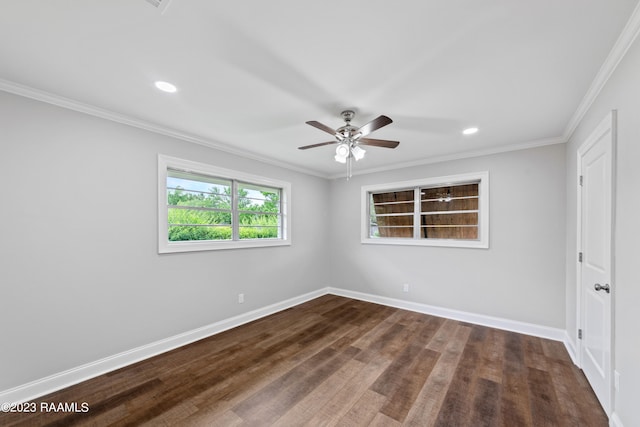 empty room with ceiling fan, crown molding, and dark hardwood / wood-style flooring