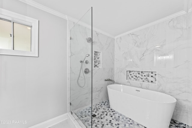 bathroom with ornamental molding and separate shower and tub