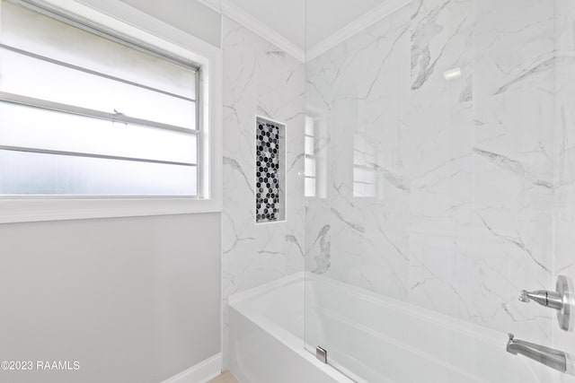 bathroom with crown molding, tiled shower / bath combo, and plenty of natural light