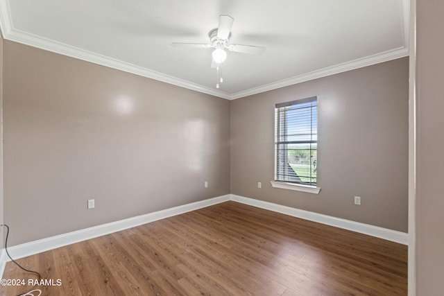 unfurnished room with ornamental molding, hardwood / wood-style floors, and ceiling fan