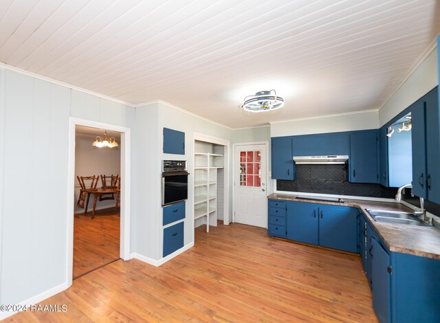 kitchen featuring black oven, sink, light hardwood / wood-style flooring, and blue cabinetry