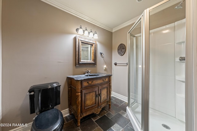 bathroom featuring ornamental molding, vanity, toilet, and a shower with door