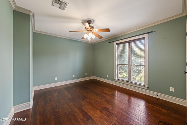 spare room featuring crown molding, dark hardwood / wood-style flooring, and ceiling fan