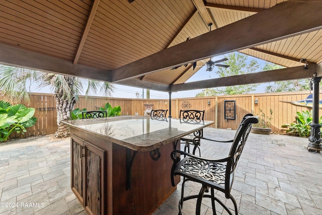 view of patio with a gazebo and a bar