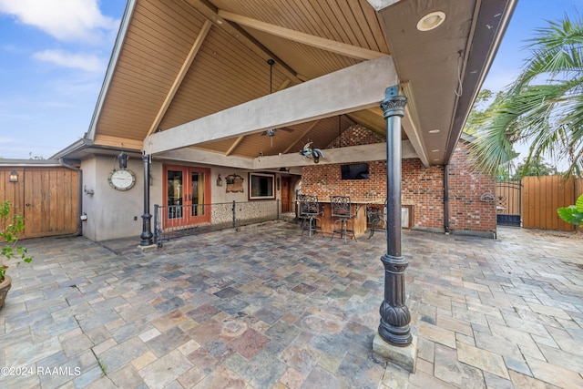 view of patio / terrace with french doors and an outdoor bar