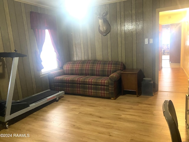 interior space featuring wooden walls and light hardwood / wood-style flooring