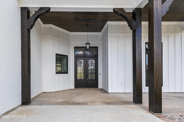 view of exterior entry featuring french doors