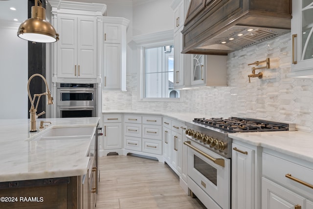 kitchen with white cabinetry and stainless steel appliances