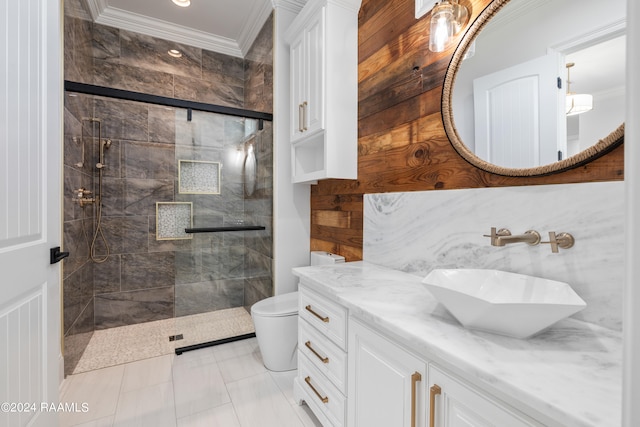 bathroom with ornamental molding, toilet, walk in shower, and vanity