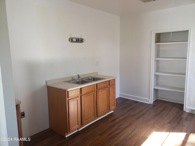 kitchen with dark wood-type flooring and sink