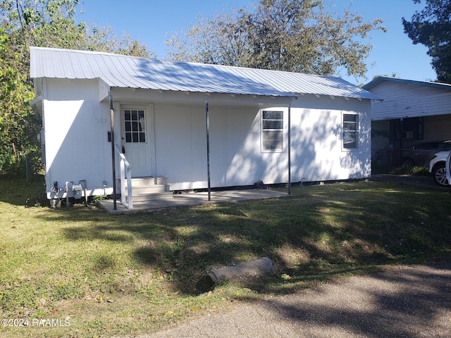 view of outbuilding featuring a yard