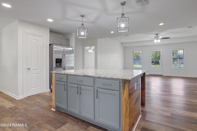 kitchen featuring ceiling fan, pendant lighting, stainless steel fridge with ice dispenser, gray cabinets, and dark hardwood / wood-style floors