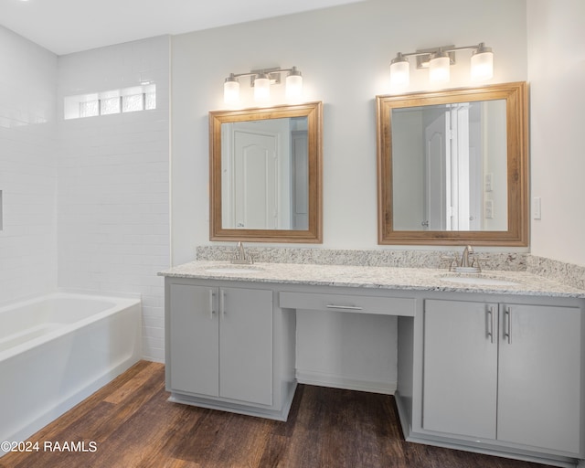 bathroom with vanity and hardwood / wood-style flooring