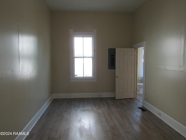 empty room with dark wood-type flooring