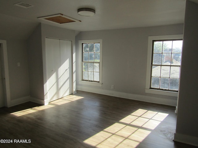 unfurnished room featuring dark hardwood / wood-style flooring