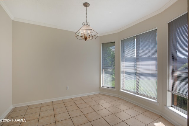 empty room featuring a wealth of natural light, a chandelier, and light tile patterned flooring