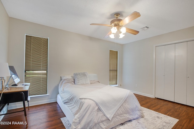 bedroom with ceiling fan and dark hardwood / wood-style flooring