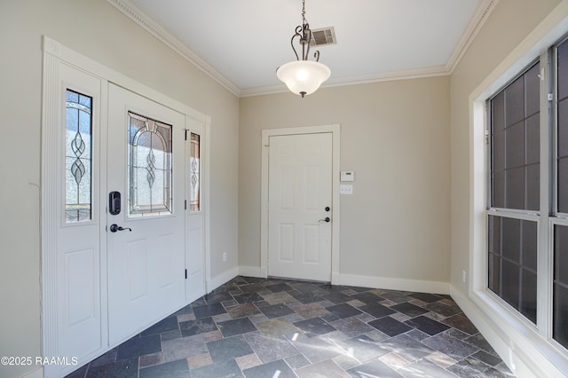 foyer entrance featuring crown molding