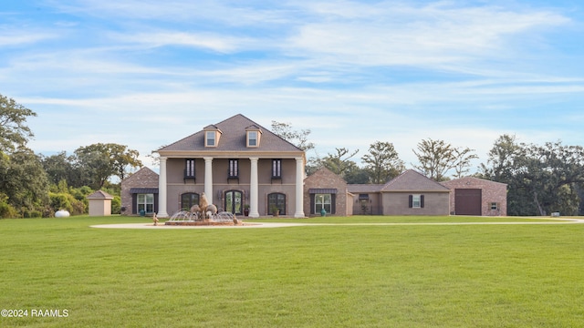 view of front facade featuring a front lawn and a garage