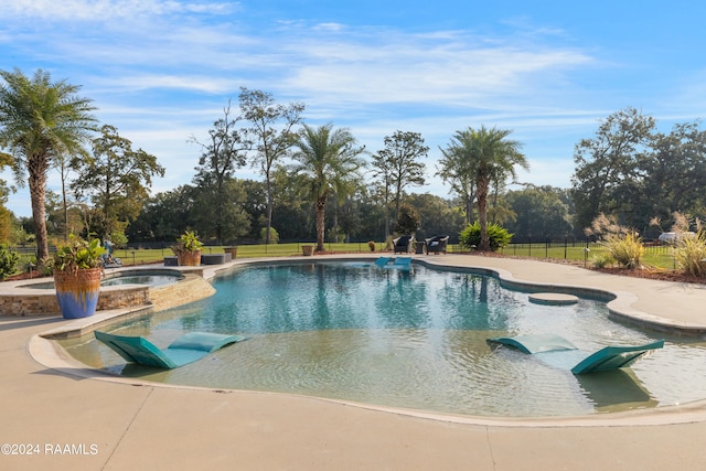 view of pool with an in ground hot tub