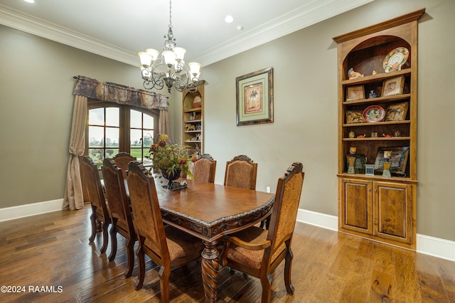 dining room featuring french doors, crown molding, wood-type flooring, and an inviting chandelier