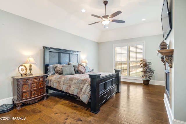 bedroom featuring lofted ceiling, ceiling fan, and dark hardwood / wood-style flooring