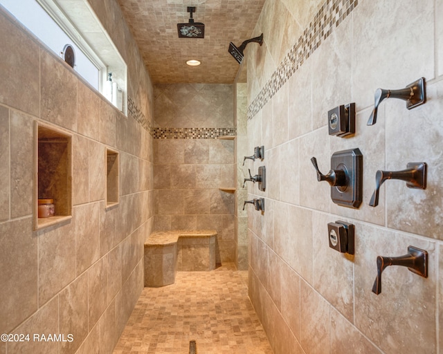 bathroom featuring a tile shower