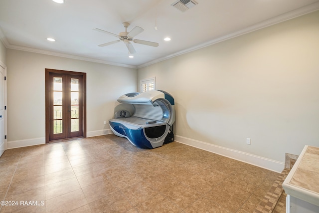 interior space featuring crown molding, french doors, and ceiling fan