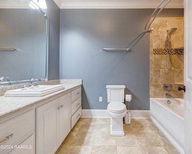 full bathroom featuring toilet, ornamental molding, vanity, tiled shower / bath combo, and tile patterned floors