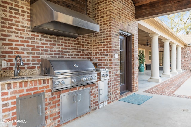 view of patio / terrace featuring area for grilling, sink, and ceiling fan