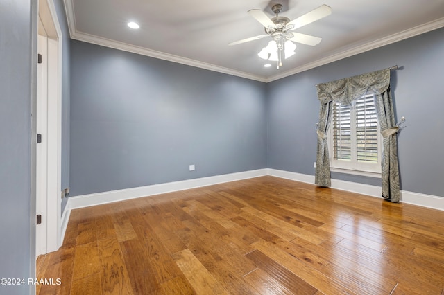 empty room with ceiling fan, wood-type flooring, and ornamental molding