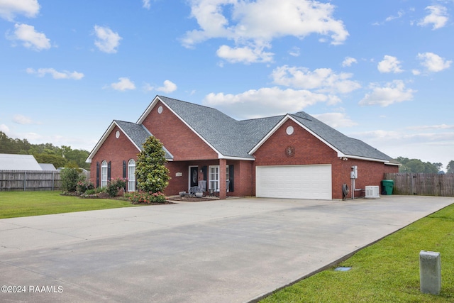 view of front of home featuring a garage and a front lawn