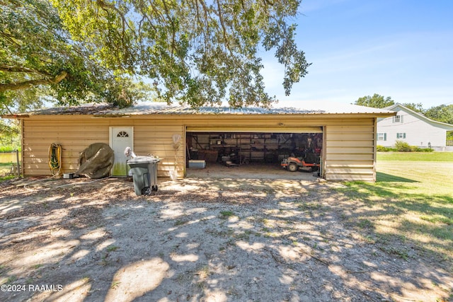 garage featuring a yard