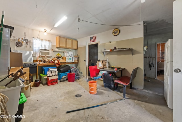 garage featuring white fridge