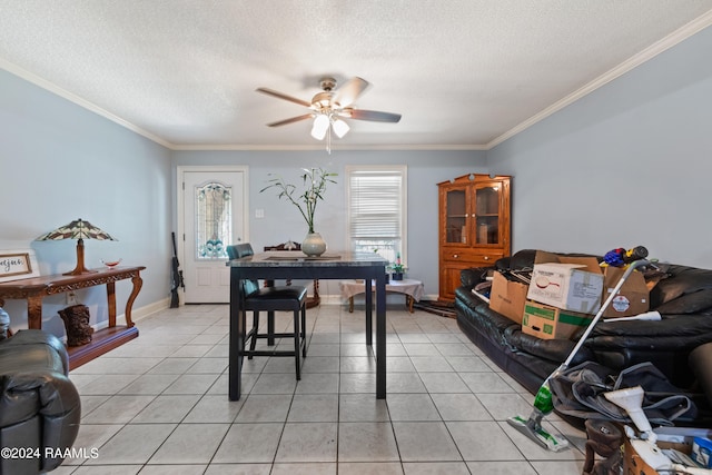 dining room featuring a textured ceiling, ceiling fan, light tile patterned floors, and crown molding