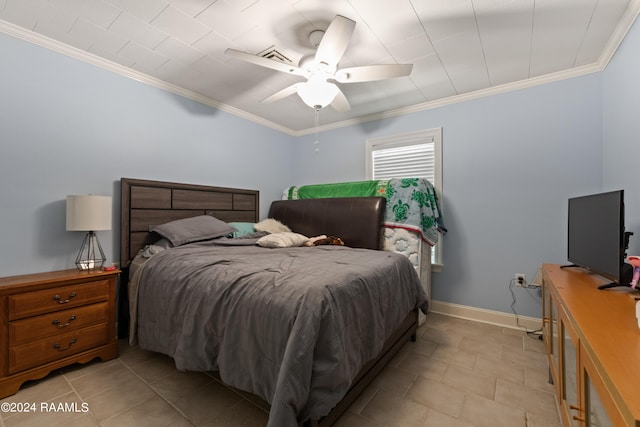 tiled bedroom featuring ceiling fan and ornamental molding