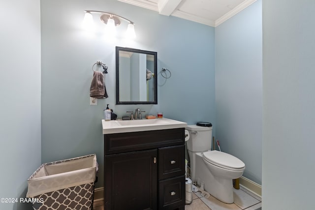 bathroom featuring crown molding, vanity, toilet, and tile patterned floors