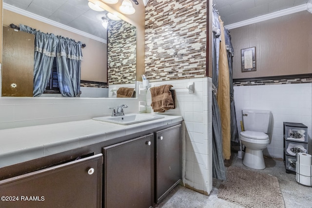 bathroom featuring ornamental molding, vanity, tile walls, and toilet